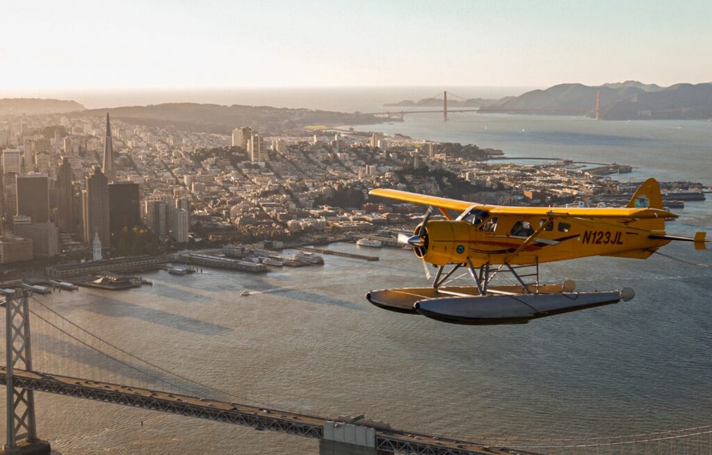 a seaplane flying above san francisco