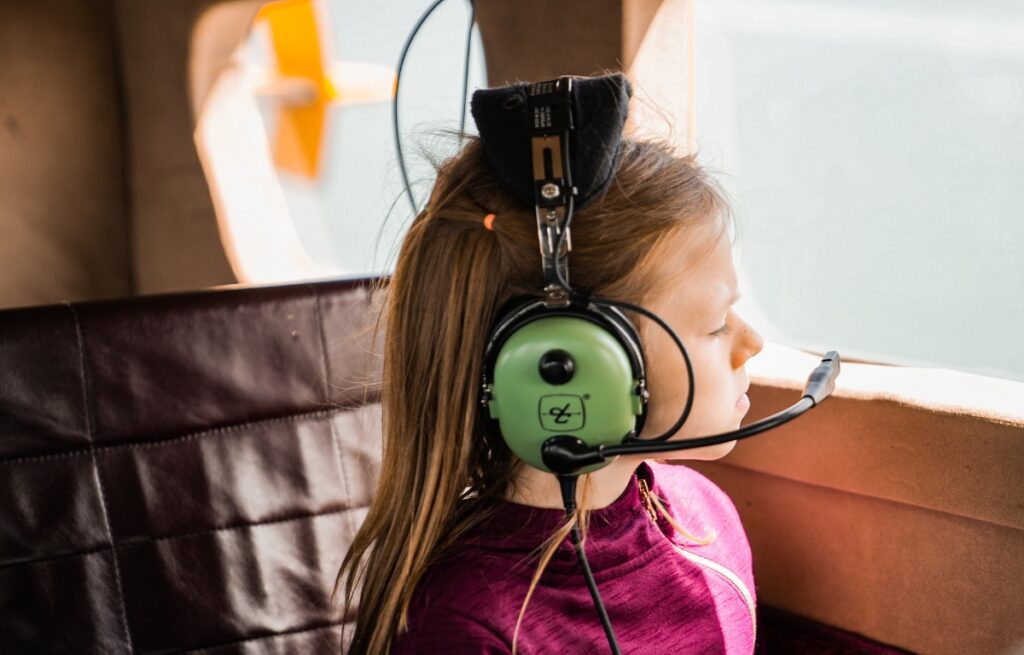child looking out of seaplane window while on a seaplane tour in san francisco
