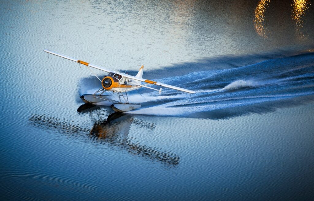 A seaplane lands in the water just outside of San Francisco